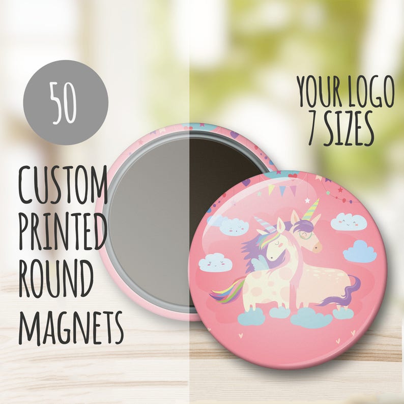 May include: 50 custom printed round magnets featuring a pink background with two unicorns, one with rainbow wings, on a cloud with a blue sky and white clouds. The text "YOUR LOGO 7 SIZES" is in the upper right corner of the image.