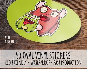 Könnte beinhalten: Ovaler Vinyl-Aufkleber mit Cartoon-Monstern in Rot und Grün auf hellgrünem Hintergrund. Der Aufkleber trägt den Text "WITH YOUR LOGO" und "50 OVAL VINYL STICKERS ECO FRIENDLY - WATERPROOF - FAST PRODUCTION".