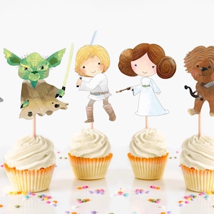 May include: Six Star Wars character cupcake toppers. The toppers are printed on cardstock and feature Darth Vader, Yoda, Luke Skywalker, Princess Leia, Chewbacca, and Han Solo.