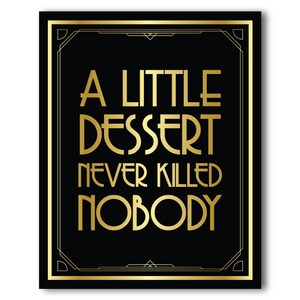 May include: Black and gold art deco style print with the text "A LITTLE DESSERT NEVER KILLED NOBODY". The text is in a bold, stylized font, and the print has a gold border.