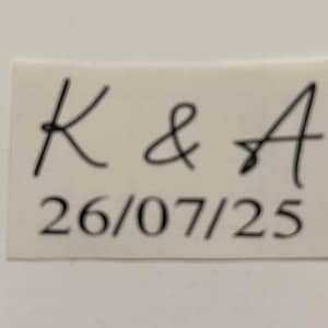 May include: A white sticker with black handwritten text that says "K & A 26/07/25".