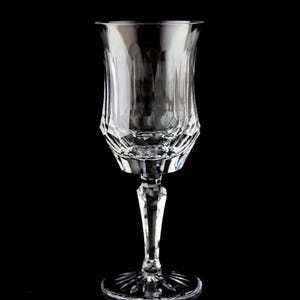May include: A clear glass wine glass with a cut crystal design. The glass has a tall stem and a wide bowl.