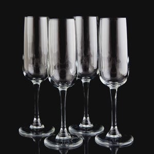 May include: Four clear champagne flutes with long stems and round bases are arranged against a black background. The glasses are made of transparent glass, reflecting light and creating a sense of elegance. The image highlights the glassware's sleek design.