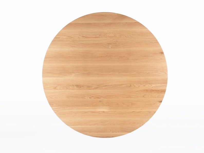 Round dining table handmade in solid white oak wood. This table has a pedestal base with four curved legs connected at the center. The look of the table is midcentury modern, Danish modern and Scandinavian.  The table available in a variety of sizes.