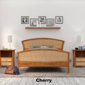 This is a handmade wooden bed with a curved headboard and footboard.  The headboard and footboard are inlaid with curved wood pieces that look like river rushes.  The bed is made with cherry and curly maple wood.