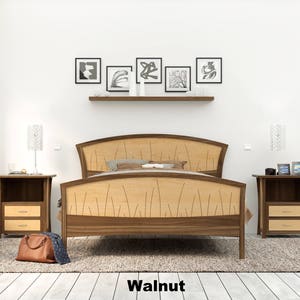 This is a handmade wooden bed with a curved headboard and footboard.  The headboard and footboard are inlaid with curved wood pieces that look like river rushes.  This picture shows the bed in walnut and curly maple wood.