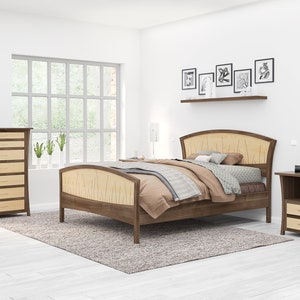 May include: A bedroom set with a wooden bed frame, two nightstands, and a dresser. The bed frame has a curved headboard and footboard with a wood grain pattern. The nightstands have a single drawer and a shelf. The dresser has six drawers. The bedroom set is made of a light wood with a dark wood trim.