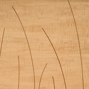 This is a detail showing the curved inlays in the headboard and footboard.