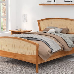 This is a handmade wood bed frame. The bed frame is shown in solid cherry and curly maple.  The curly maple headboard is inlaid with curved contrasting wood pieces that look like river rushes.  The bed is shown with matching nightstands.