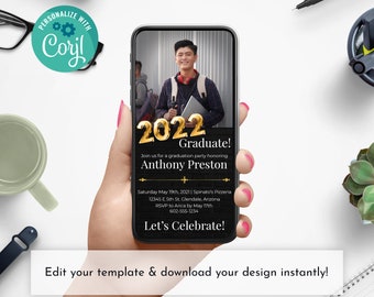 May include: A smartphone displays a graduation party invitation. The invitation features the text "2022 Graduate!" in gold, along with the graduate's name, party details, and a call to RSVP. The phone is held in a hand, with other objects on a white surface.