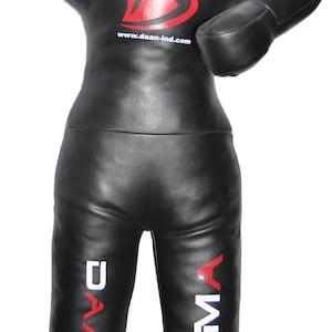 May include: Black MMA training dummy with a target design on the head. The dummy has a red and white target on the head and the text "DAAN" and "MMA" in white and red on the legs. The dummy has the website address www.daan-ind.com.