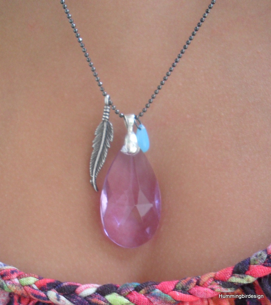 A Purple Crystal Lpendant Necklace on a Tiny Black Ball