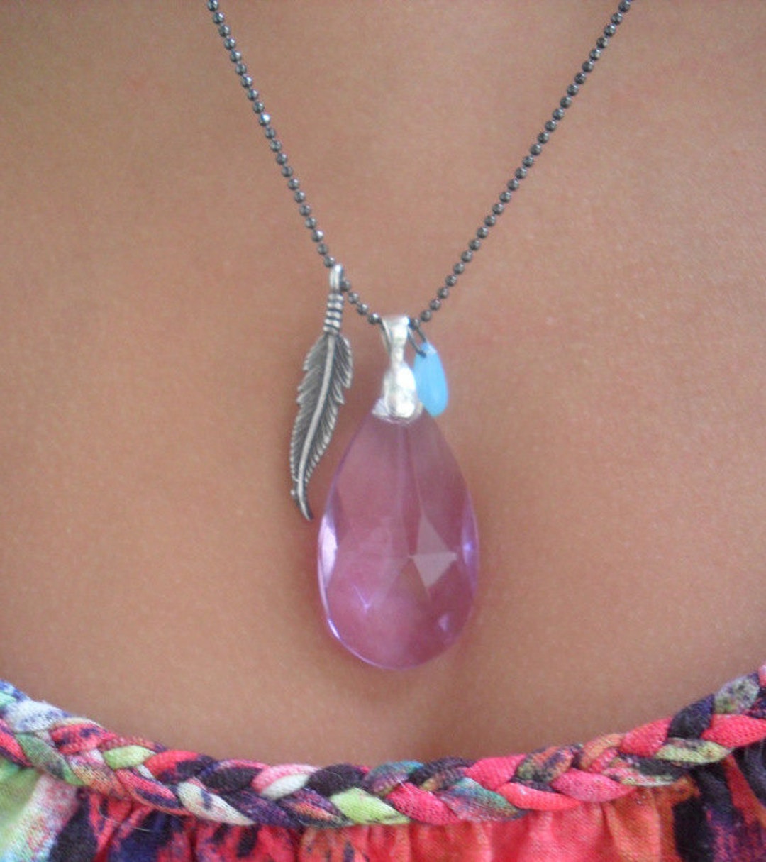 A Purple Crystal Lpendant Necklace on a Tiny Black Ball