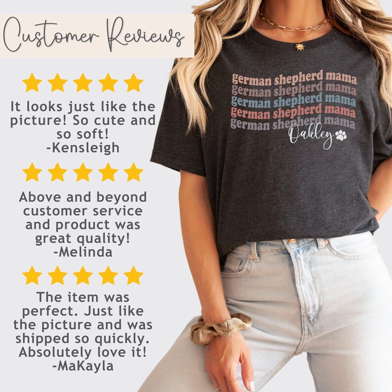 May include: A dark grey t-shirt with the text "german shepherd mama" repeated in different colors and a personalized name "Oakley" with a paw print. The shirt is being worn by a person with a light brown hair.