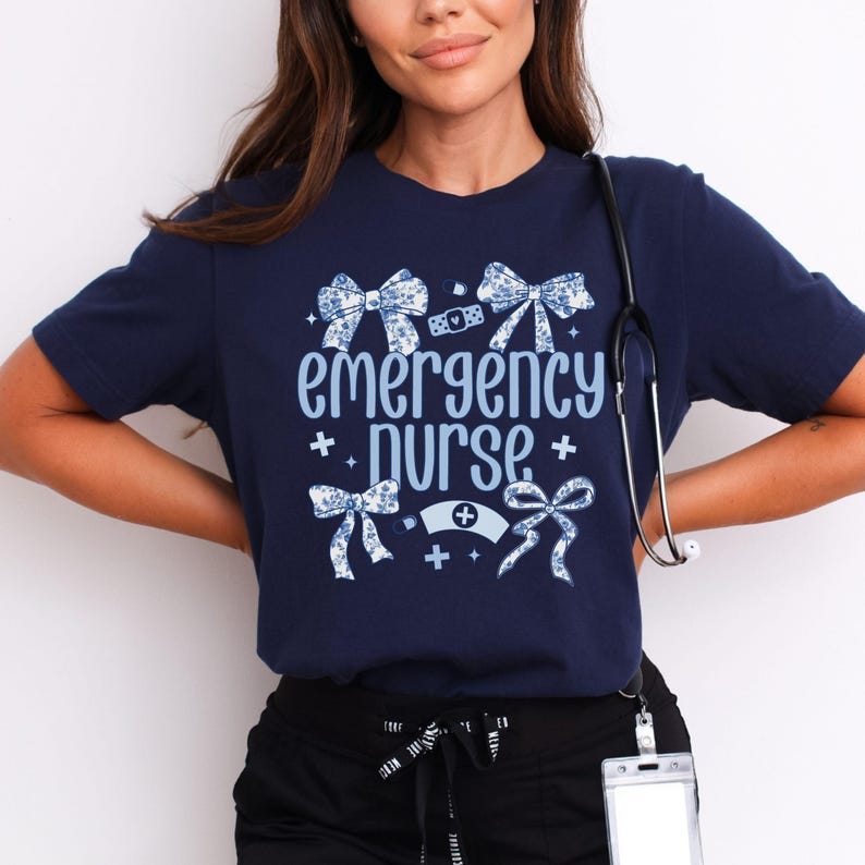 May include: A navy blue t-shirt with a white and blue floral design and the text "emergency purse".