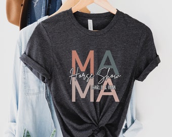 May include: A dark grey t-shirt with the words "Mama Horse Show" in pink, peach, and blue lettering. The text "Charlie & Vina" is printed in white below the main text.