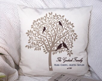 May include: A beige throw pillow with a brown tree design and four brown birds. The text "The Goodrich Family Russ - Cheryl - Austin - Skyler est 1995" is printed on the pillow.