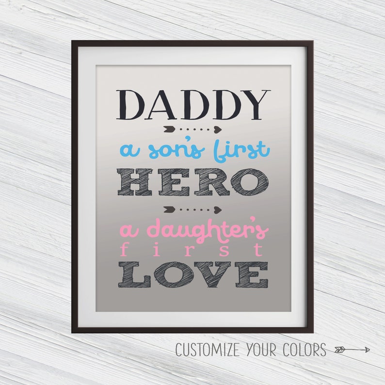 May include: A framed print with the text "Daddy, a son's first hero, a daughter's first love" in black with blue and pink accents on a gray background. The text "Customize Your Colors" is at the bottom of the print.
