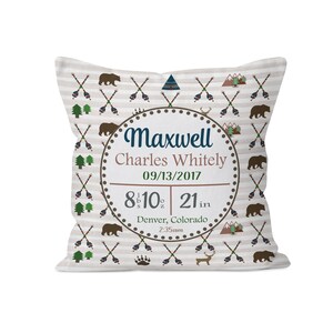 May include: A white pillow with a brown and white patterned design featuring bears, arrows, and mountains. The pillow has a circle in the center with the text "Maxwell Charles Whitely 09/13/2017 8 lb 10 oz 21 in Denver, Colorado 2:35am"