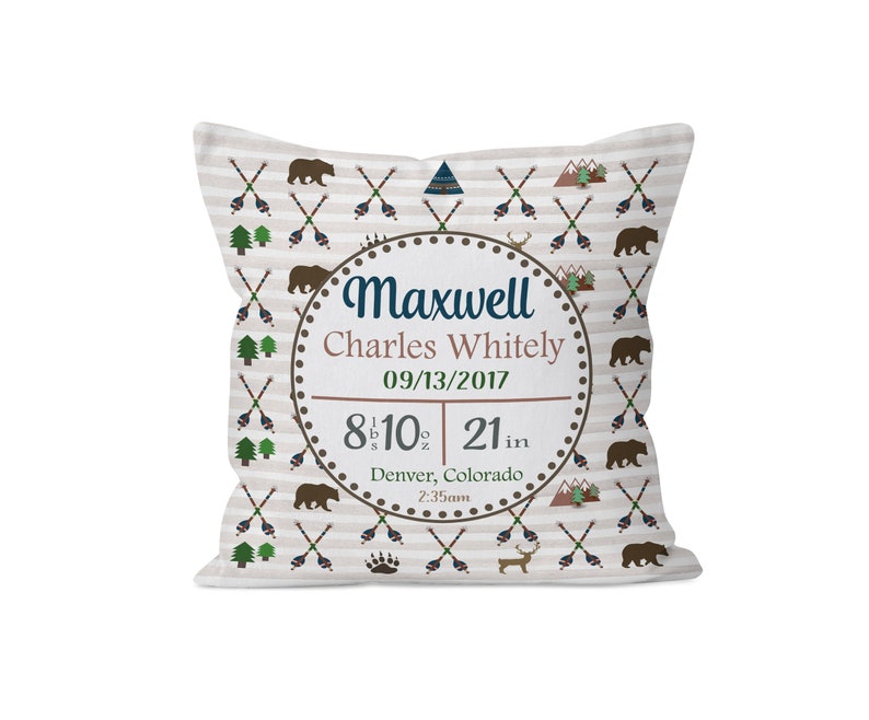 May include: A white pillow with a brown and white patterned design featuring bears, arrows, and mountains. The pillow has a circle in the center with the text "Maxwell Charles Whitely 09/13/2017 8 lb 10 oz 21 in Denver, Colorado 2:35am"