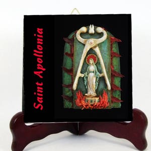 May include: A religious artwork featuring Saint Apollonia on a black background. The image includes a statue of a woman with a halo, set against a green and red backdrop, with the saint's name in red text.