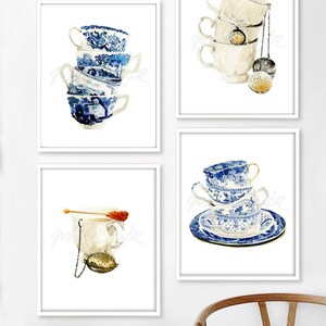 May include: Four watercolour paintings of teacups. The first painting shows a stack of four blue and white teacups. The second painting shows a stack of three white teacups with a tea strainer hanging from the top cup. The third painting shows a single white teacup with a tea strainer and a sugar stick. The fourth painting shows a stack of three blue and white teacups on a blue and white saucer.
