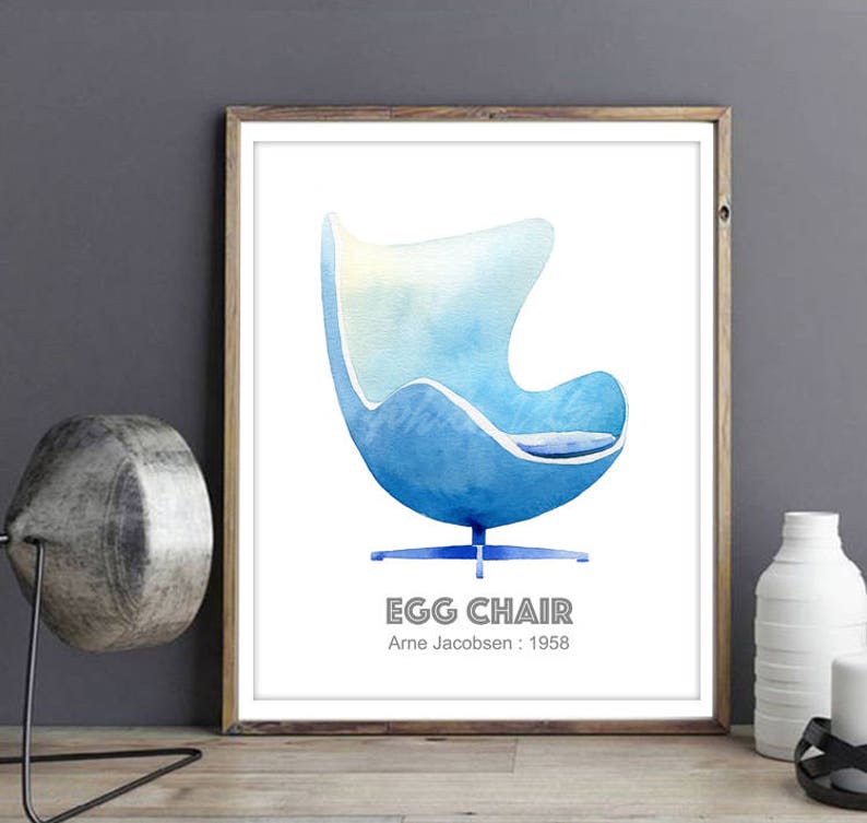 May include: A watercolor illustration of a blue Egg Chair designed by Arne Jacobsen in 1958. The chair is a classic mid-century modern design.