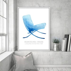 May include: A watercolor illustration of a blue Barcelona chair designed by Ludwig Mies Van Der Rohe in 1929. The chair is depicted in a minimalist style with a white background.