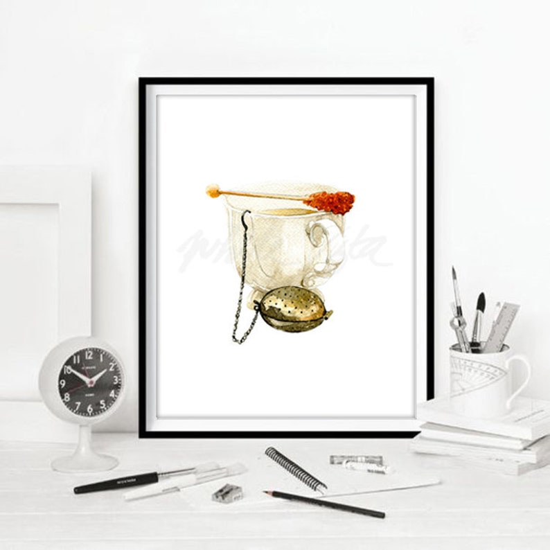 May include: A watercolour painting of a white teacup with a tea infuser and a sugar cube on a stick. The teacup is filled with tea and the infuser is hanging from the side of the cup.