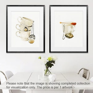 May include: Two framed watercolour illustrations of teacups. The first image shows three stacked teacups with a tea infuser hanging from the top cup. The second image shows a single teacup with a tea infuser and a sugar stick.