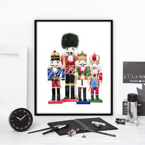 May include: A watercolor painting of five nutcracker soldiers. The soldiers are all wearing different colored uniforms and hats. The soldier in the center is the tallest and has a black hat and a red uniform. The other soldiers are shorter and have different colored hats and uniforms.
