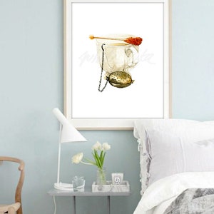 May include: A watercolour painting of a white teacup with a tea infuser and a sugar cube on a stick. The teacup is on a white background.
