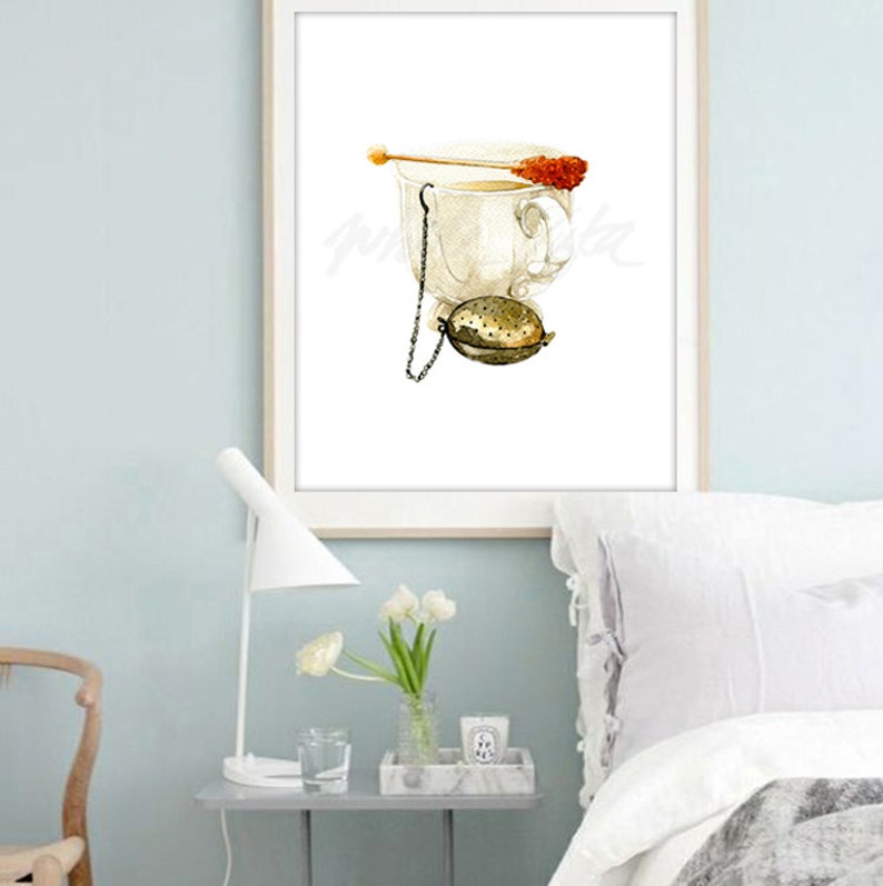 May include: A watercolour painting of a white teacup with a tea infuser and a sugar cube on a stick. The teacup is on a white background.