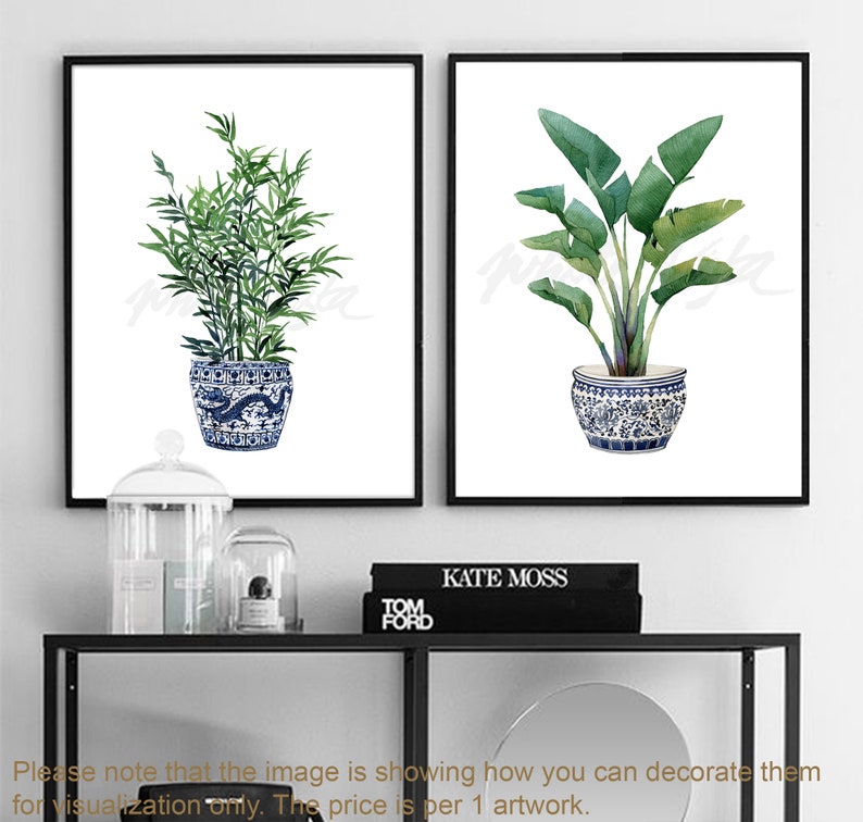 May include: Two watercolor prints of plants in blue and white ceramic pots. The print on the left features a green leafy plant, while the print on the right features a green tropical plant with large leaves.