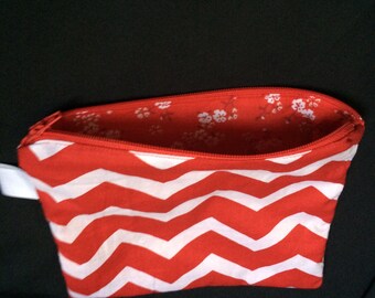 Red and white chevron lined zipper pouch