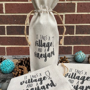 This ‘It Takes a Village and a Vineyard’ canvas wine bottle bag is excellent for jazzing up a gift or adding personality to that wine bottle sitting on your counter. This design is printed on a 100% linen pouch with a jute drawstring.