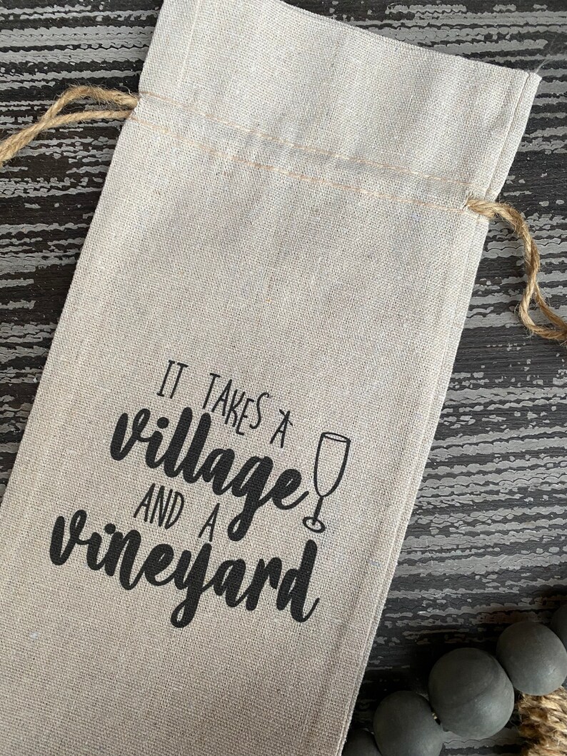 This ‘It Takes a Village and a Vineyard’ canvas wine bottle bag is excellent for jazzing up a gift or adding personality to that wine bottle sitting on your counter. This design is printed on a 100% linen pouch with a jute drawstring.