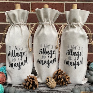 This ‘It Takes a Village and a Vineyard’ canvas wine bottle bag is excellent for jazzing up a gift or adding personality to that wine bottle sitting on your counter. This design is printed on a 100% linen pouch with a jute drawstring.