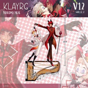 Peut inclure: Un présentoir en acrylique représentant deux personnages animés, l'un en costume rayé rouge et l'autre en costume blanc, sur une base en forme de piano. Le présentoir mesure 18 cm de haut et comporte des notes de musique et des portées.