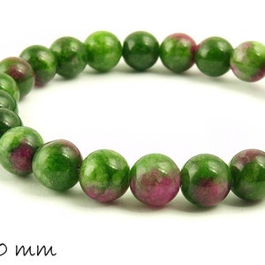 Peut inclure: Bracelet en pierres précieuses vertes et roses avec des perles rondes, chacune mesurant 10 mm de diamètre.