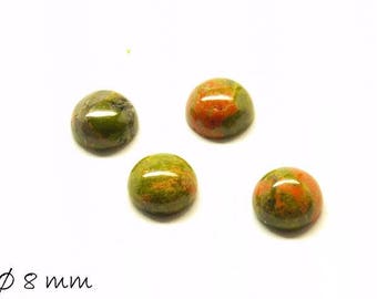 May include: Four round, green and orange gemstone cabochons, each measuring 8mm in diameter.