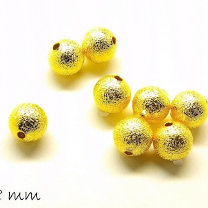 Metal beads (Stardust) in gold, 8 mm