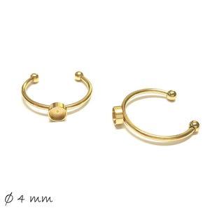 May include: Two gold-colored, open-ended rings with a circular setting and small ball accents. The rings are approximately 4 mm in diameter. The rings are displayed on a white background.