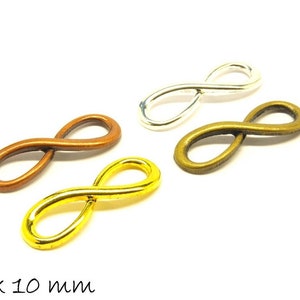 May include: Four infinity symbol charms in different metal finishes: silver, gold, bronze, and copper. Each charm measures 30 x 10 mm.