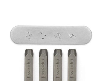 May include: Four metal stamps with the word "ImpressArt" engraved on each. The stamps are used to create impressions of birds in flight on metal surfaces.