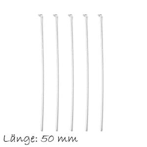 Pode incluir: Cinco pinos de cabeça prateados, cada um com 50 mm de comprimento, estão dispostos verticalmente sobre um fundo branco. Os pinos de cabeça são usados para fazer joias e artesanato.
