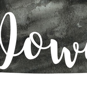 May include: A black and white watercolor illustration of the state of Iowa with the word "Iowa" written in white cursive lettering.