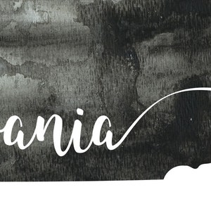 May include: A black and white watercolor illustration of the state of Pennsylvania with the word "Pennsylvania" written in white cursive script.