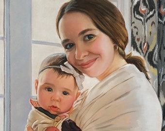 May include: A woman in a brown and white checkered dress holds a baby in a beige sling. The baby is wearing a pink and white outfit and a headband with a white bow. The woman is smiling and looking at the camera. The background is a window with white blinds and a patterned curtain.