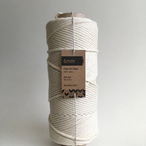 May include: A roll of 6mm natural ecru fiber art rope made from 100% cotton. The rope is 550 feet or 167 meters long.